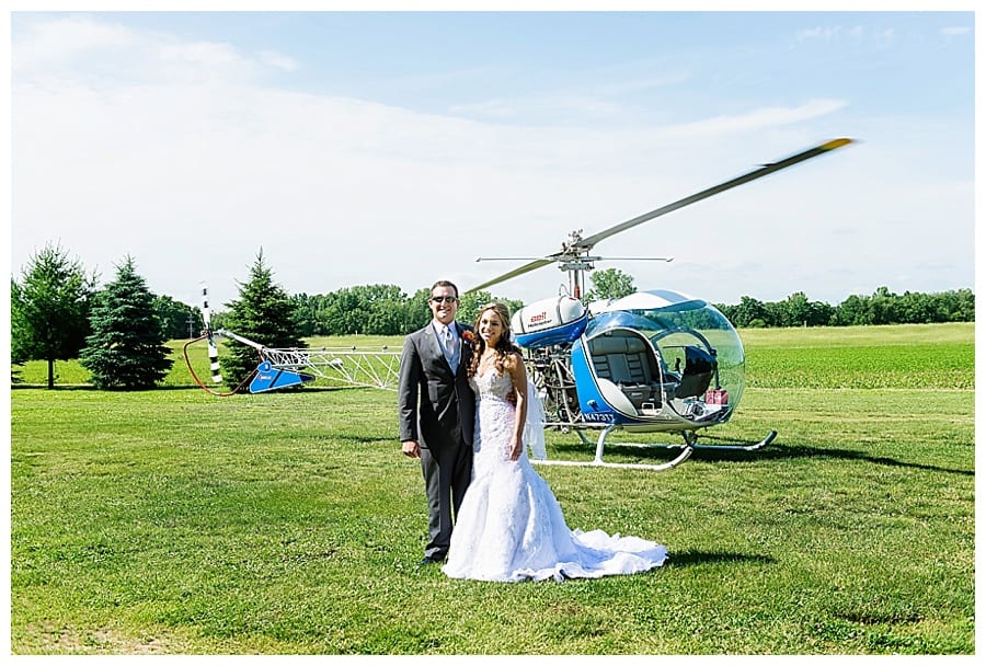 bride and groom with helicopter