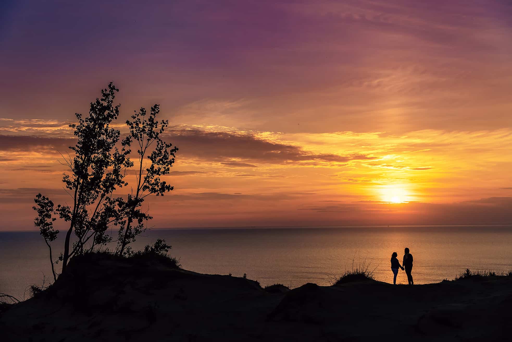 sunset on Lake Michigan in sleeping bear dunes engagement session
