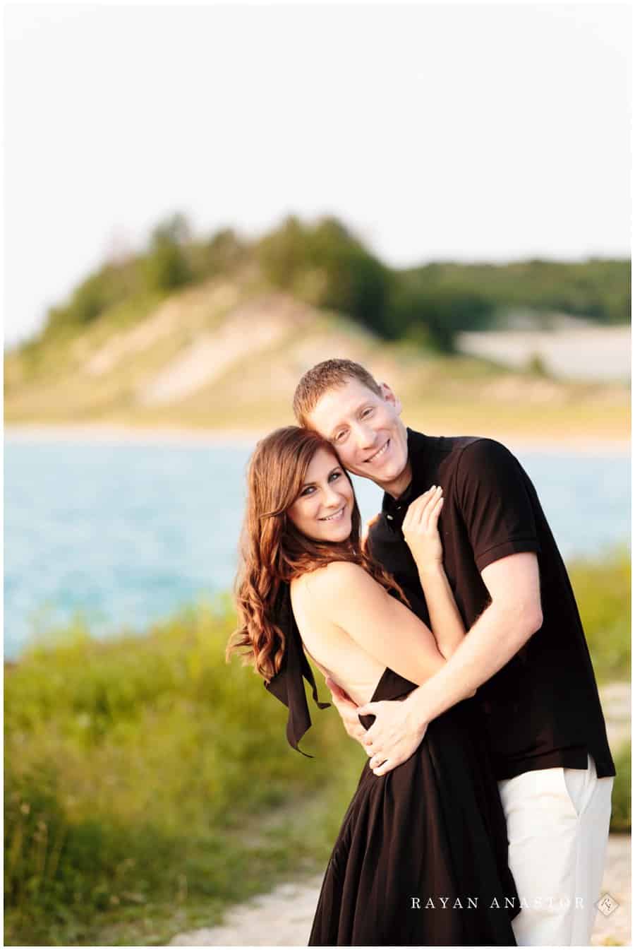 Couple during sunset on Lake Michigan at Lighthouse