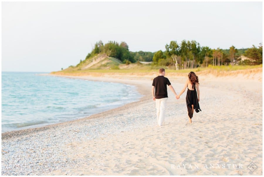 Couple walking the beach in sleeping bear dunes national park