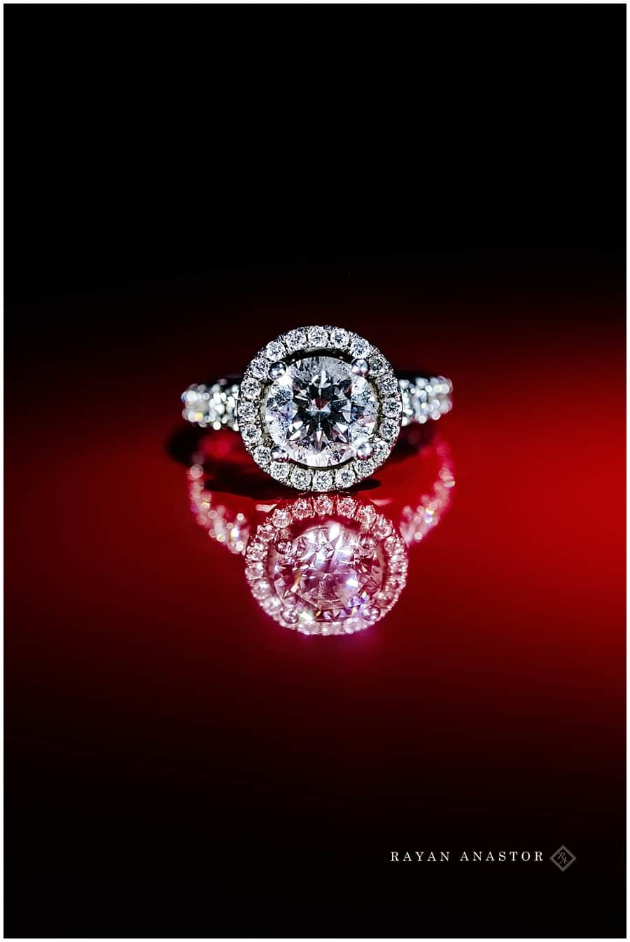 engagement ring with red reflection