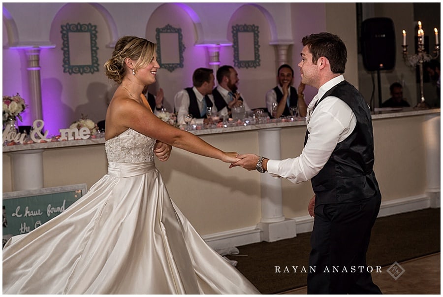 groom spinning bride at first dance