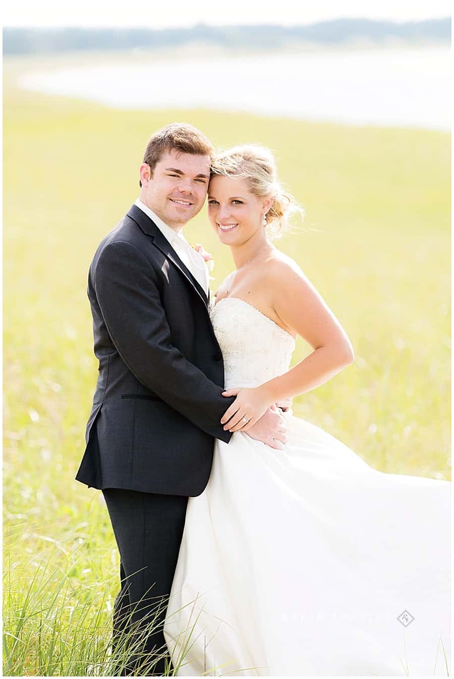 Bride and Groom on lake michigan in dune grass