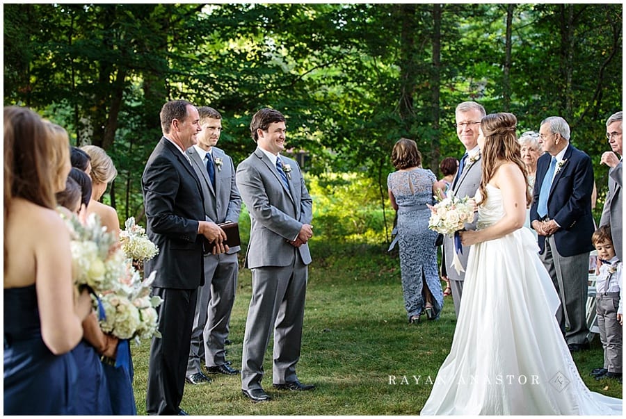 bride and dad and groom during the wedding