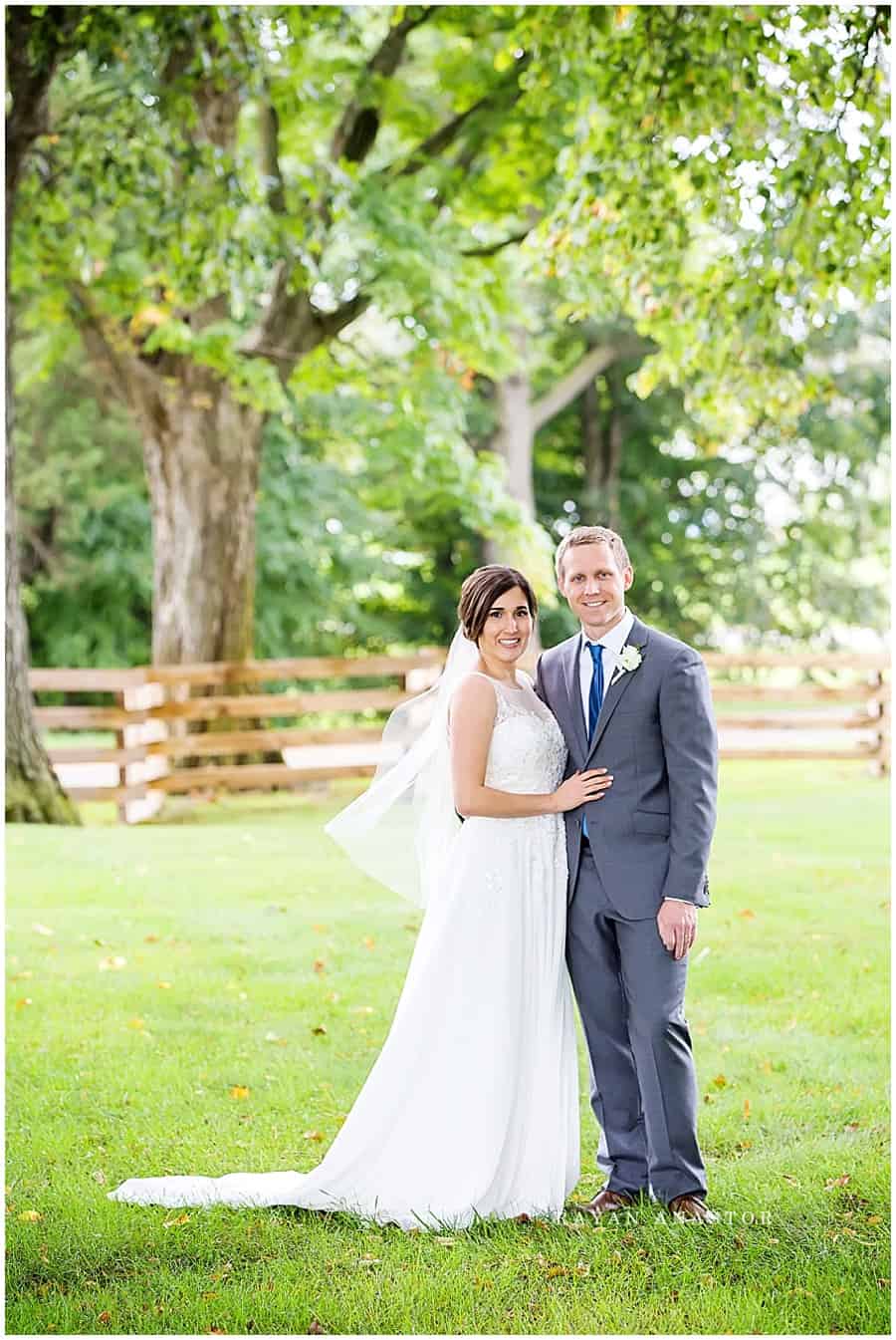 bride and groom on the grounds of zingermans