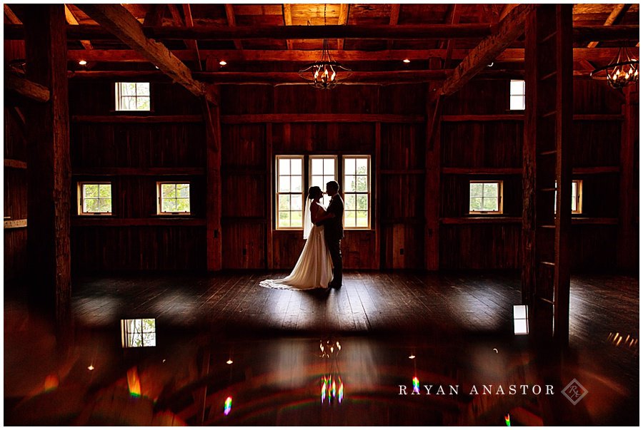 bride and groom on the grounds of zingermans