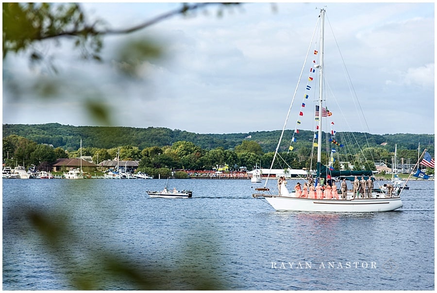 bride and groom on sail boat after wedding