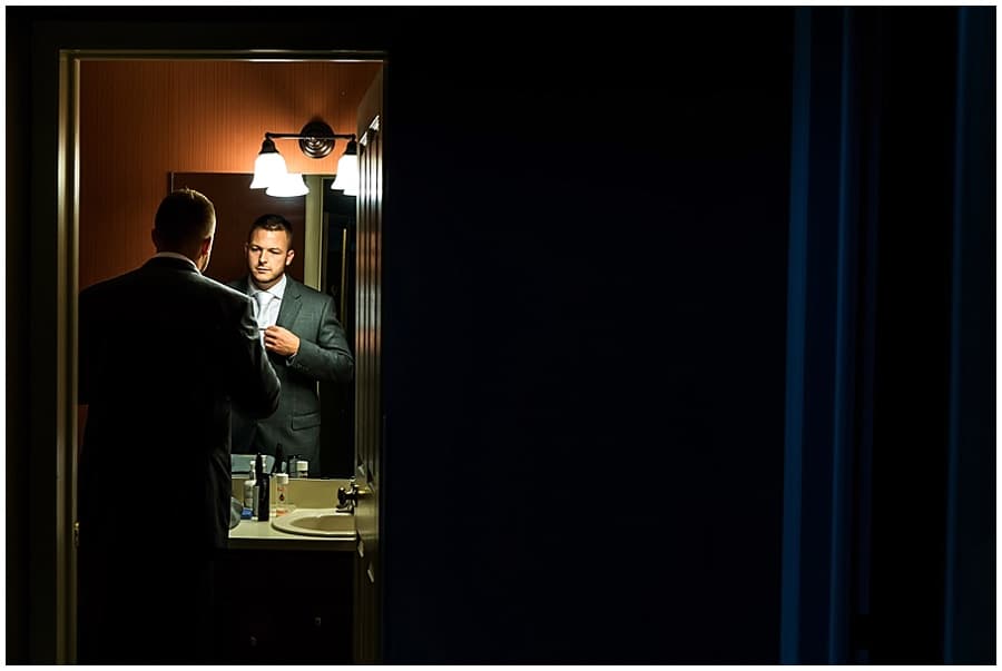 groom getting ready at crystal mountain
