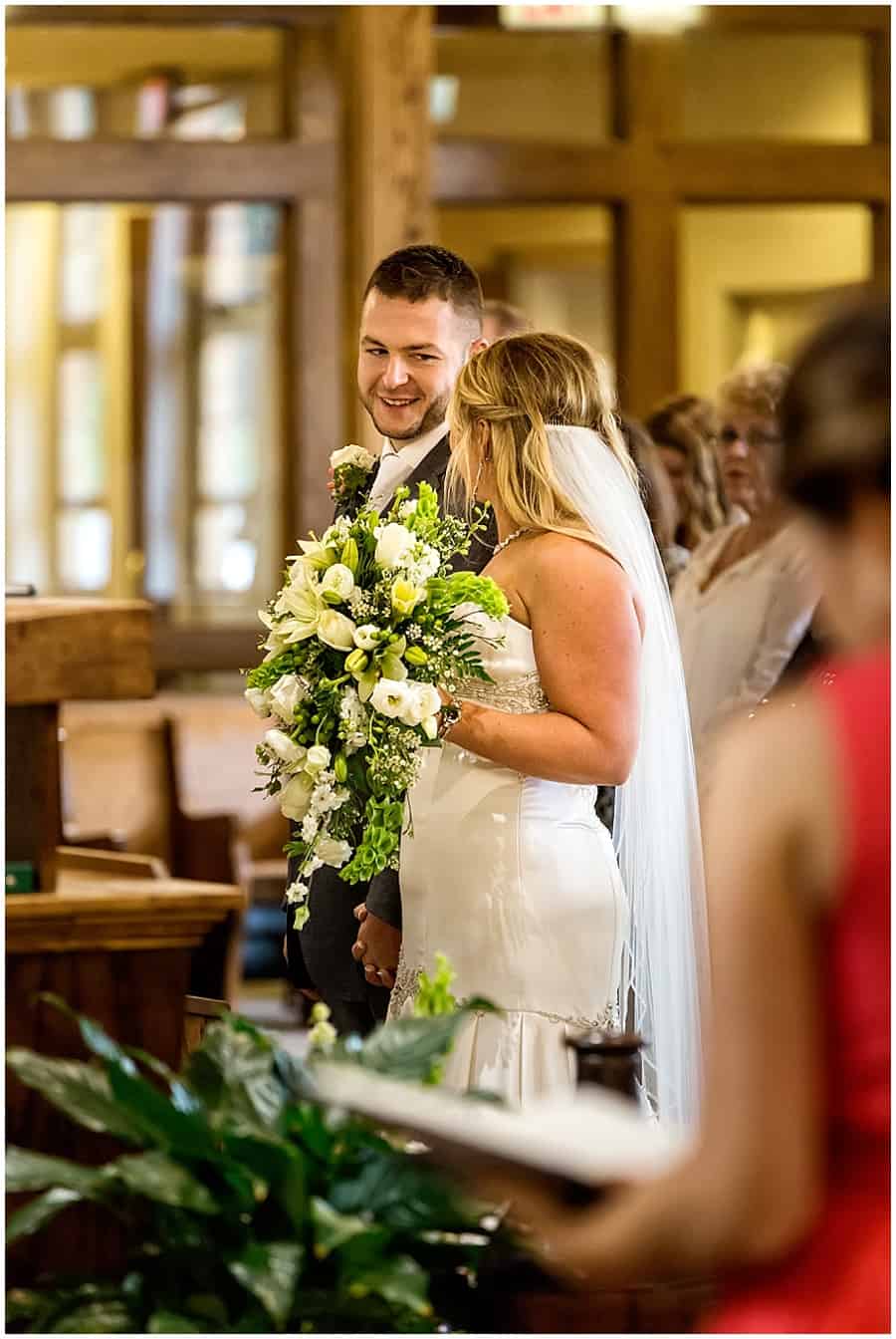 bride and groom during catholic ceremony