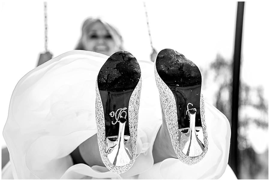 brides shoes say i do while on swing