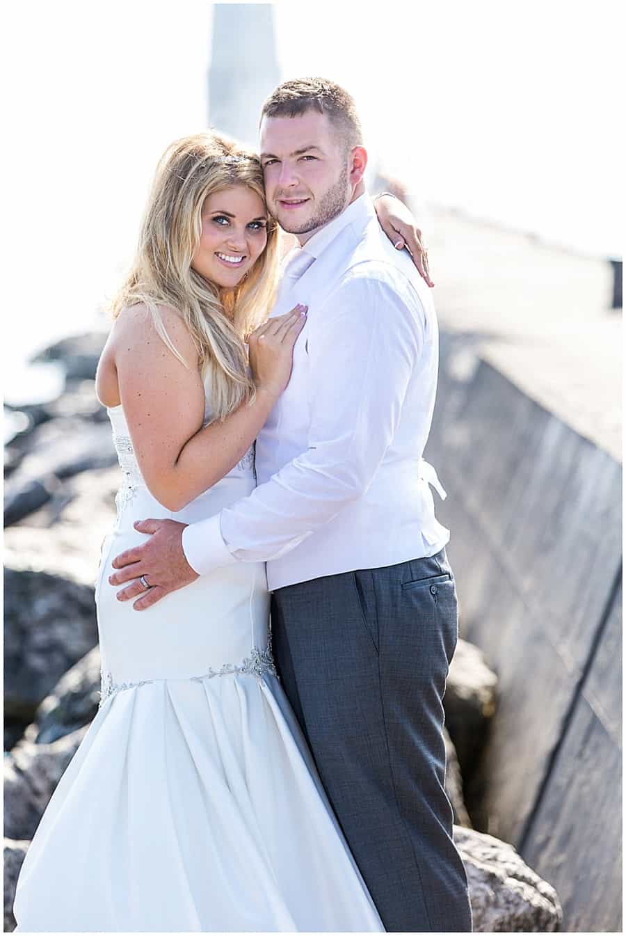 bride and groom on frankfort mi pier