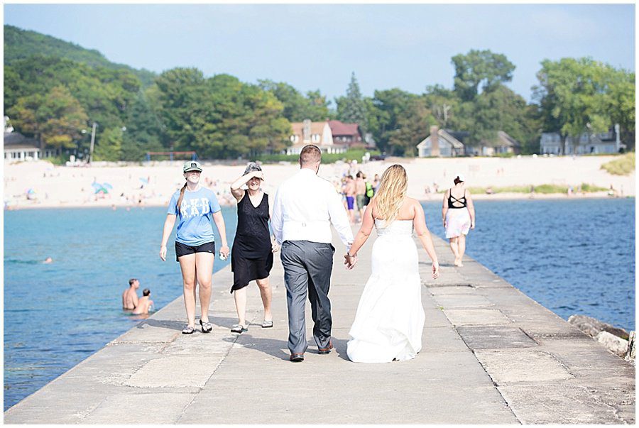 bride and groom on frankfort mi pier