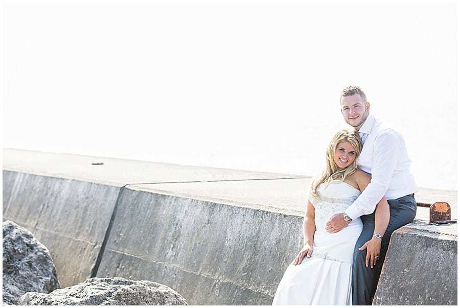 bride and groom on frankfort mi pier