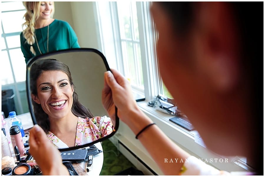 bride seeing her makeup