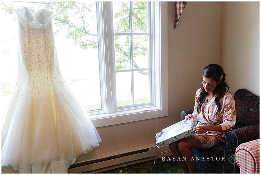 bride opening grooms gift