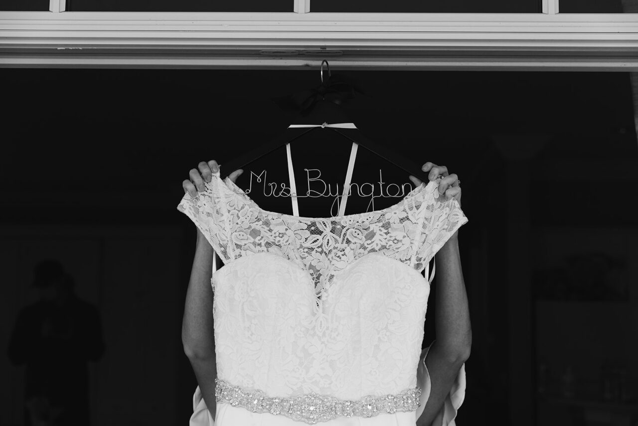 Bride getting dressed at Inn at Bay Harbor