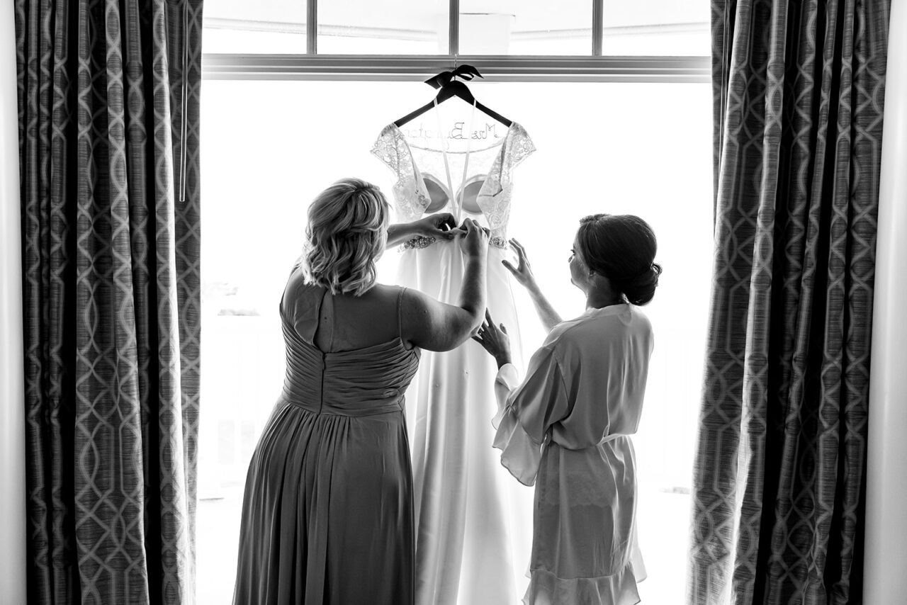 Bride getting dressed at Inn at Bay Harbor