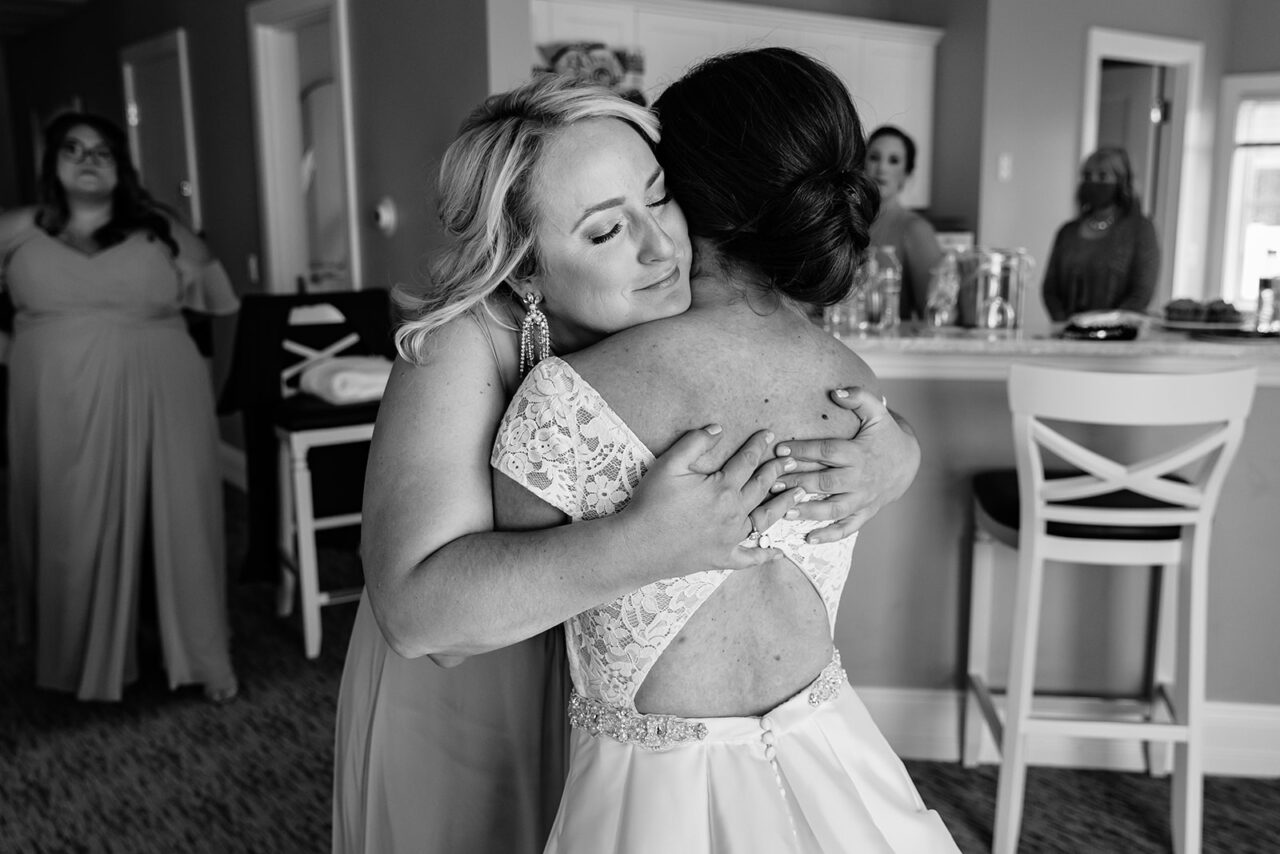 Bride getting dressed at Inn at Bay Harbor