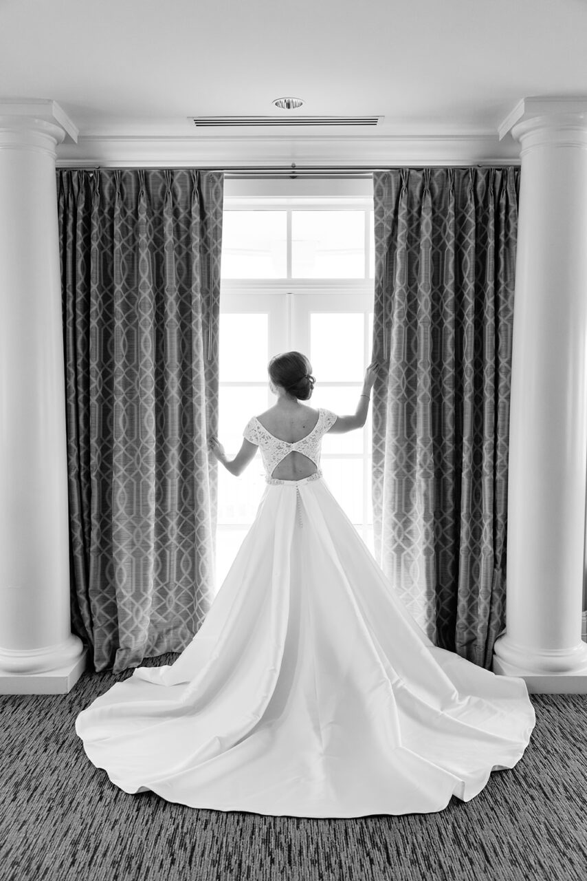 Bride getting dressed at Inn at Bay Harbor