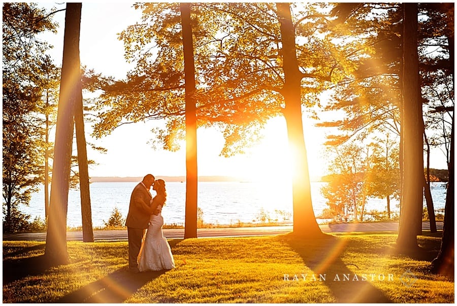 Sunset wedding portrait on west bay in traverse city