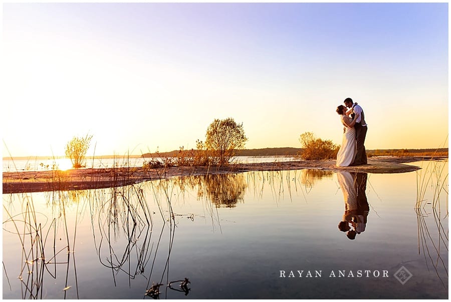 Bride and groom at sunset at bowers harbor inn