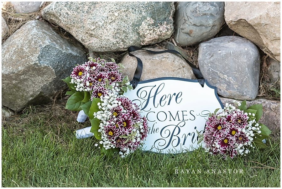 Here comes the bride sign with purple flowers