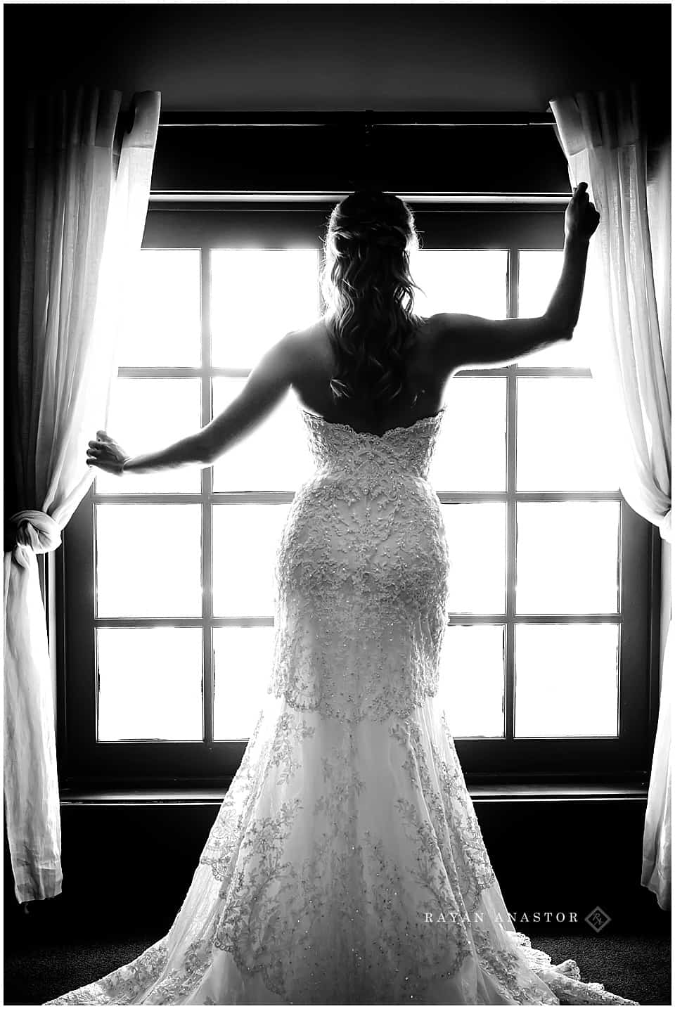 silhouette of bride at window