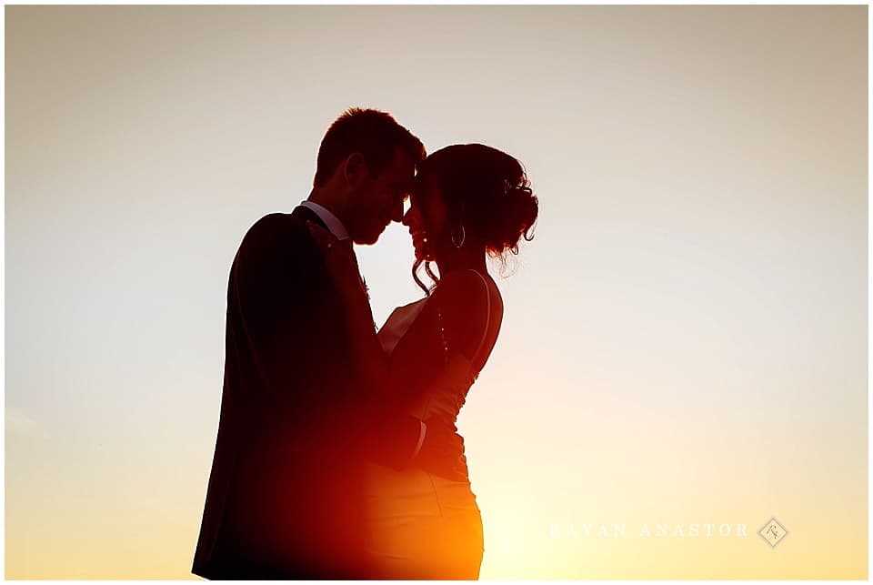 bride and groom portraits on Lake Michigan at sunset