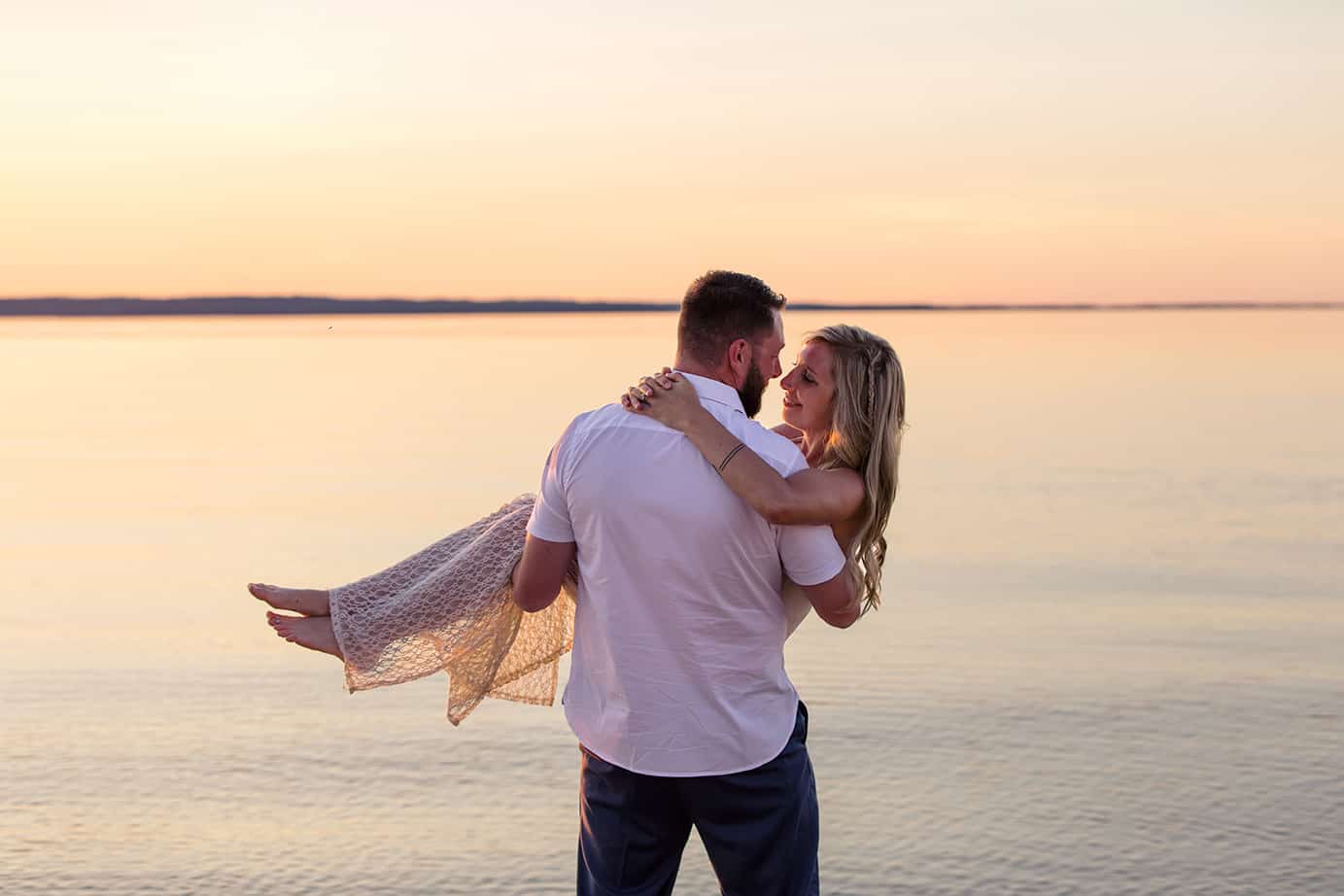 bride and groom at sunset wedding on Lake Michigan