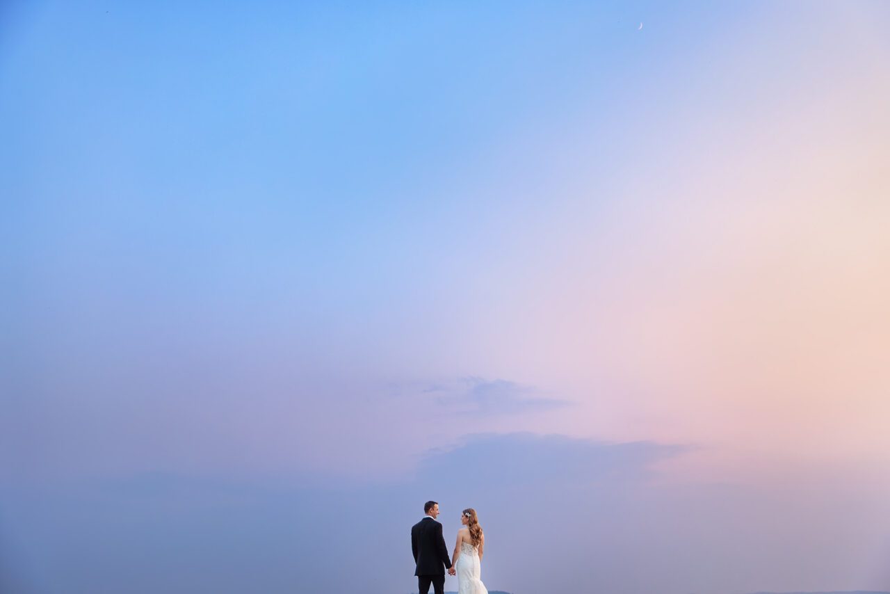 Bride and Groom at Sunset with smoke from wildfires on old mission peninsula