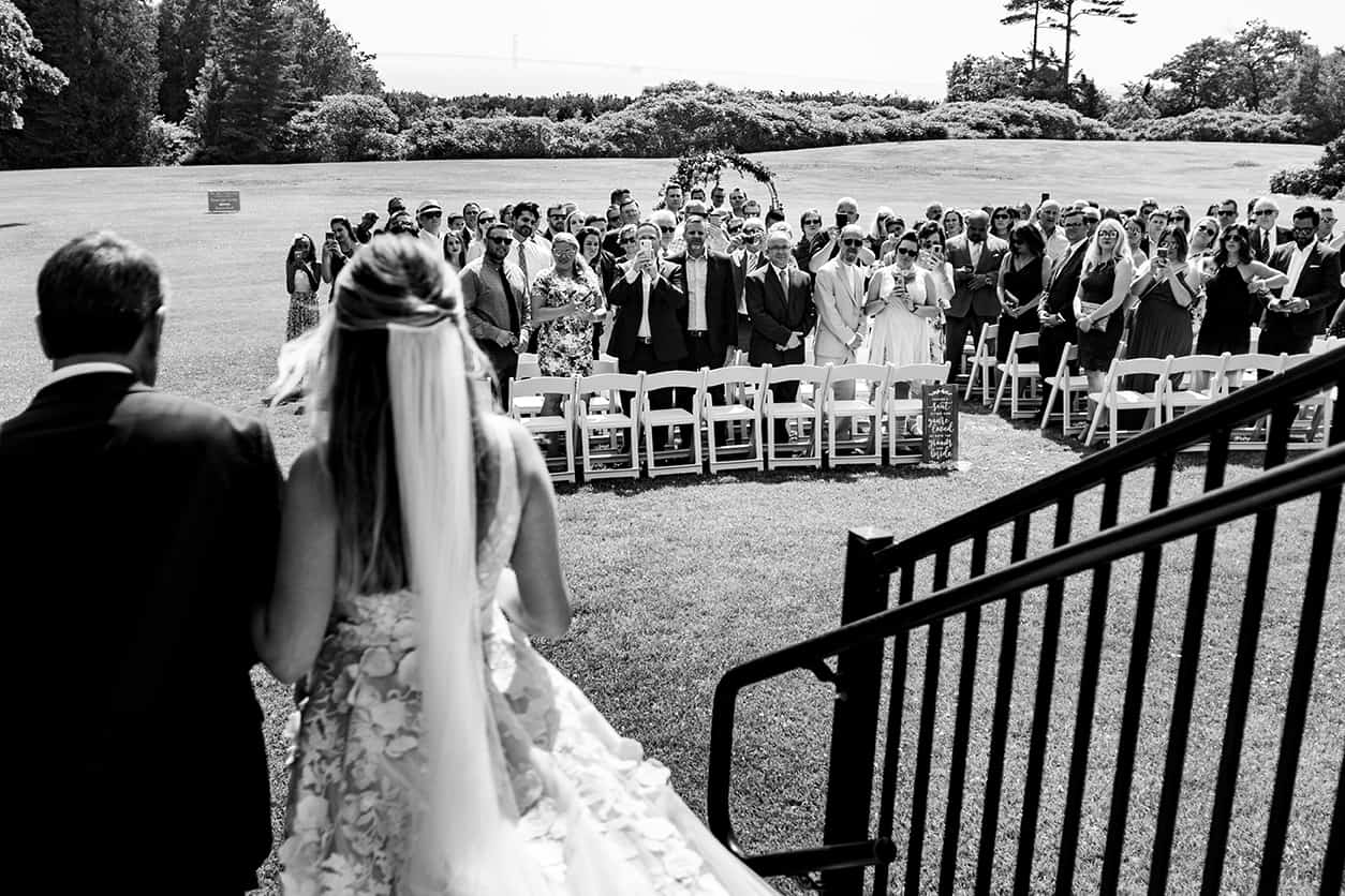 bride walking down aisle at inn at stonecliffe