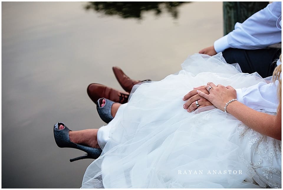 bride and groom on boardwalk in traverse city