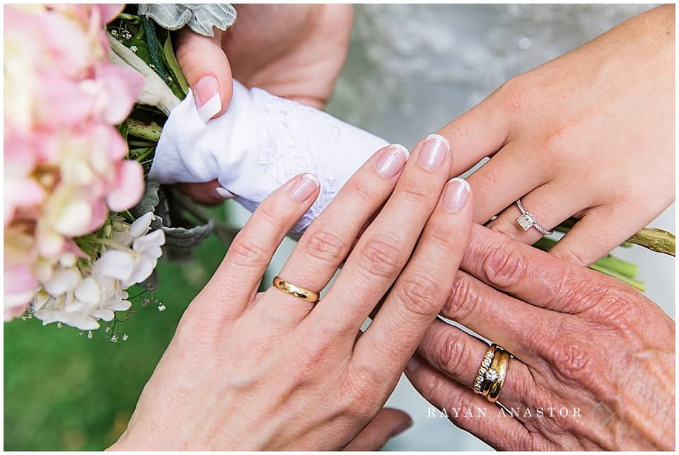 three generations of hands and wedding rings