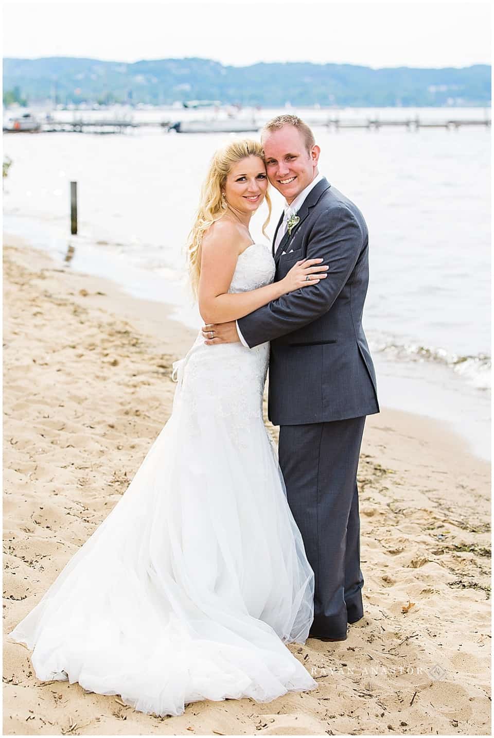 bride and groom overlooking grand traverse bay