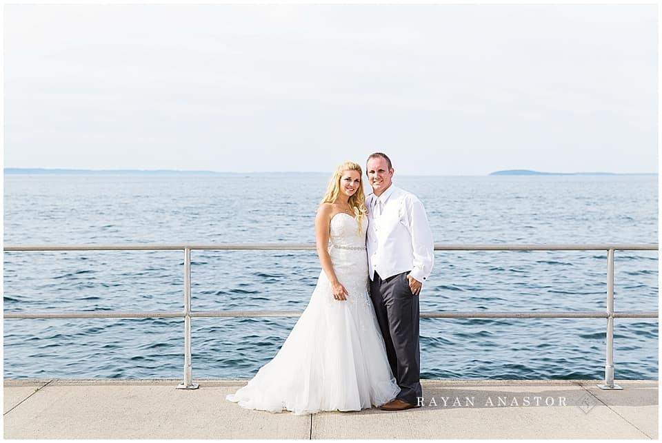 bride and groom overlooking grand traverse bay