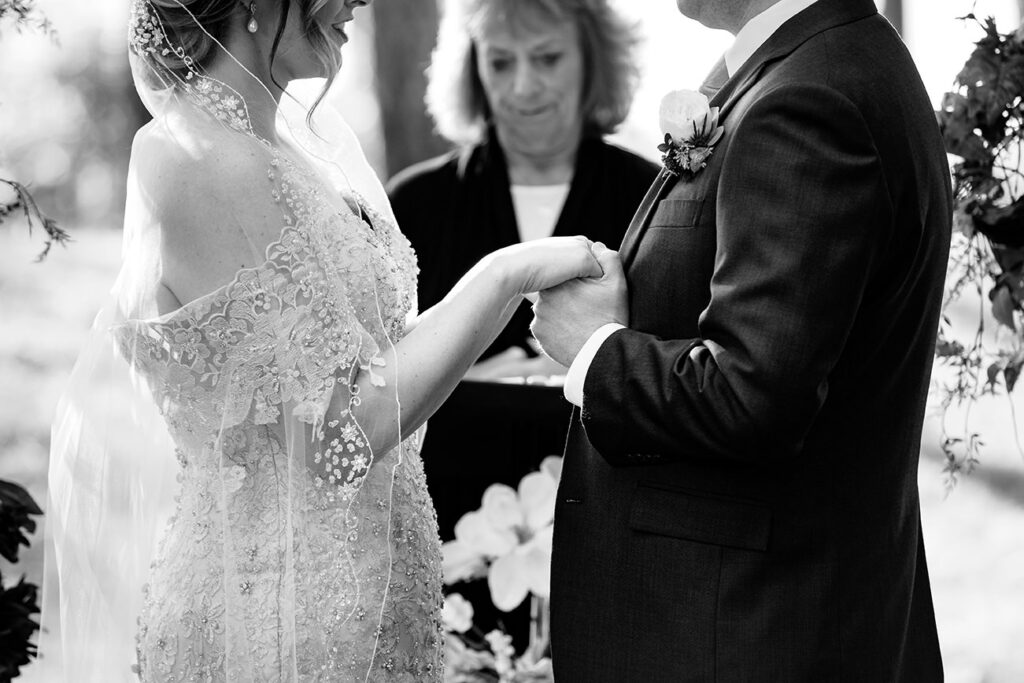 Bride and Groom Holding Hands at Mission Table Elopement Wedding