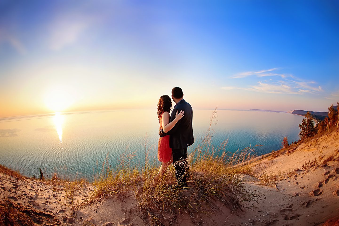 Couples engagement photos on empire bluffs at sunset