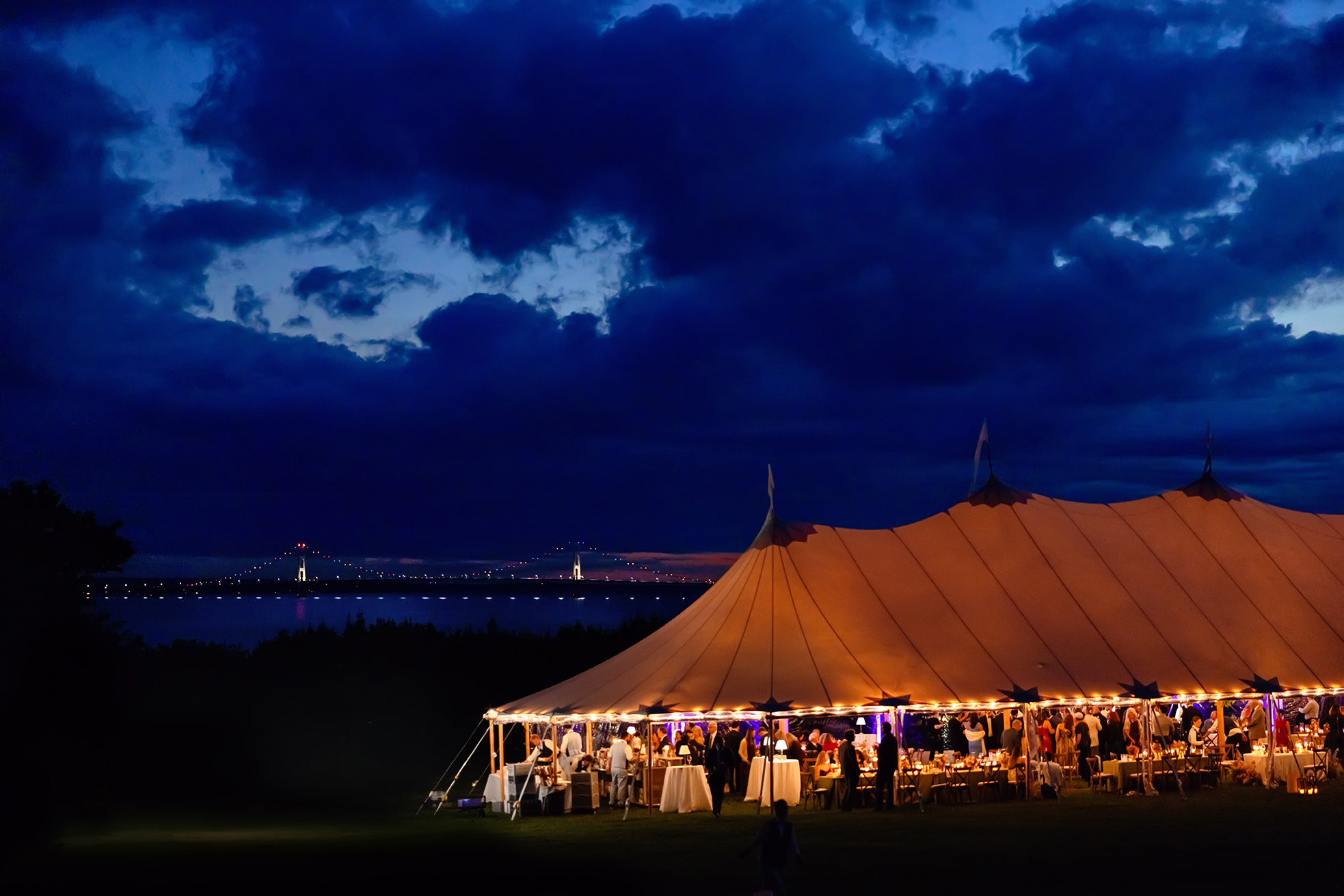 Mackinac Island Night tent wedding overlooking Mackinac bridge