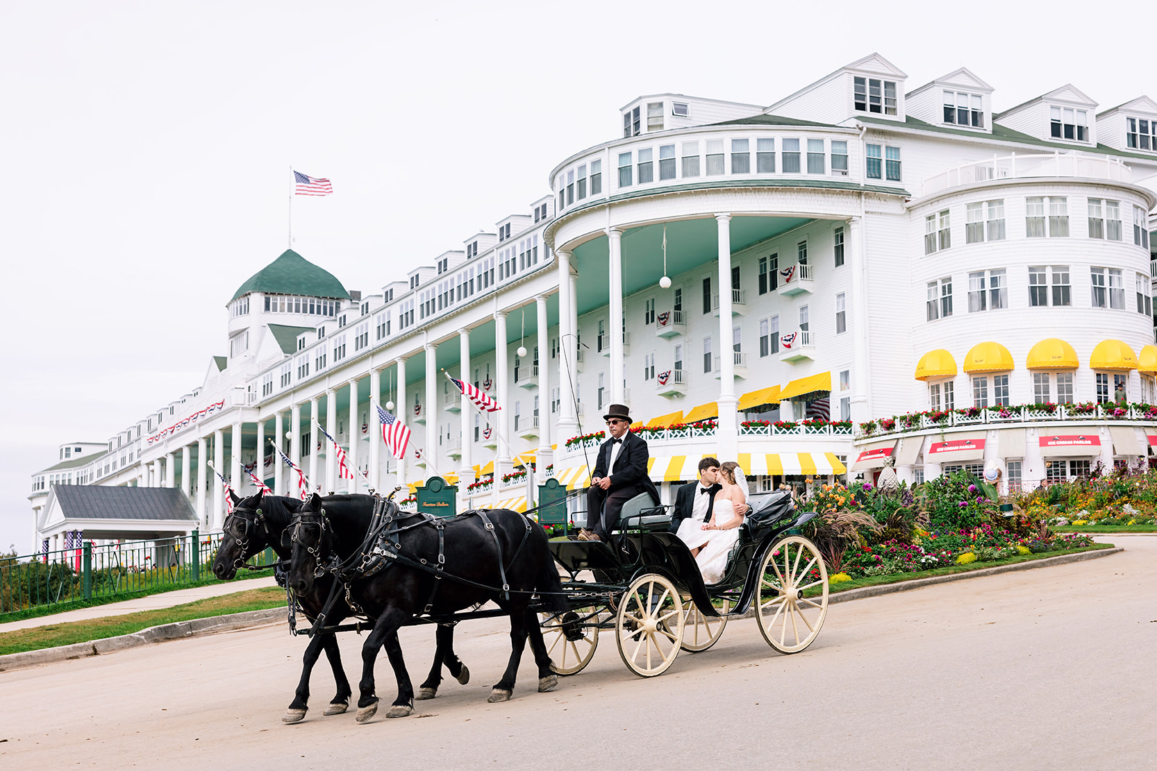 Bride and Groom in horse and carriage at the Grand Hotel on Mackinac Island