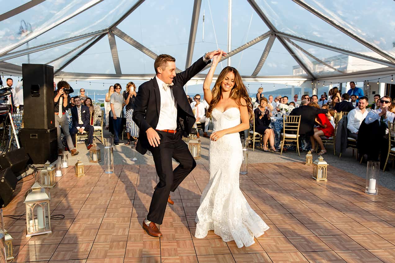Bride and Grooms first dance under clear tent with candles