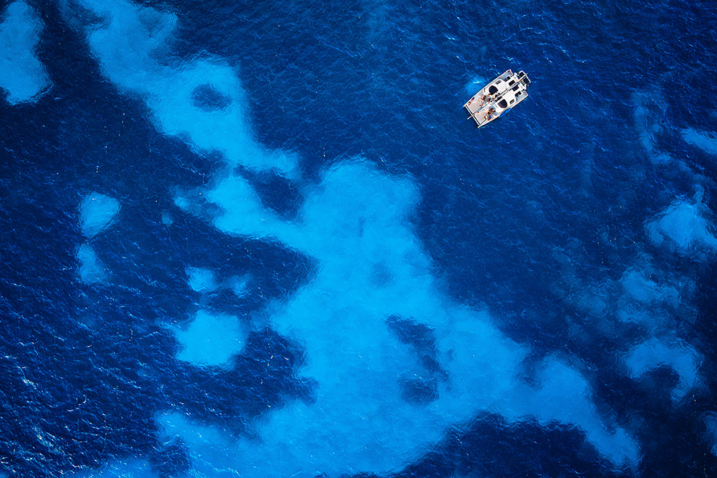 drone photo of sunset catamaran cruise wedding