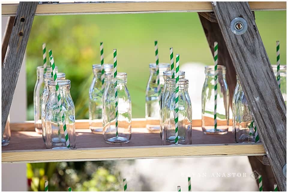 coca cola bottles with green and white straws at wedding reception