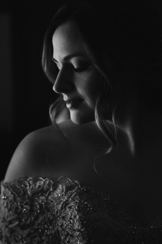 intimate photo of bride getting dressed for wedding