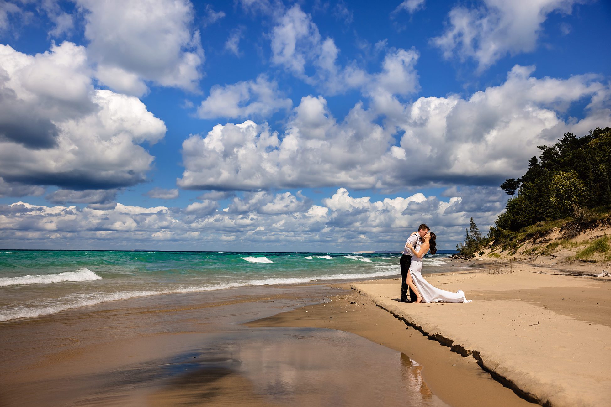 bride and groom in dunes on lake michigan