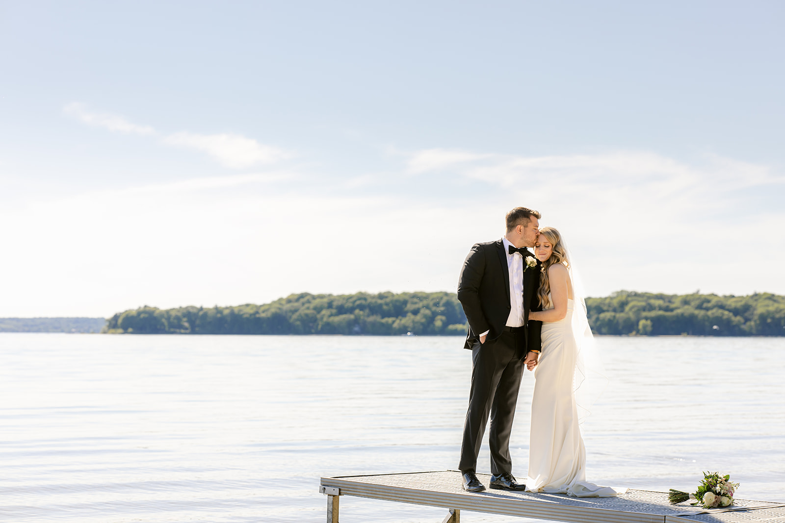 bride and groom on Lake Michigan in traverse city