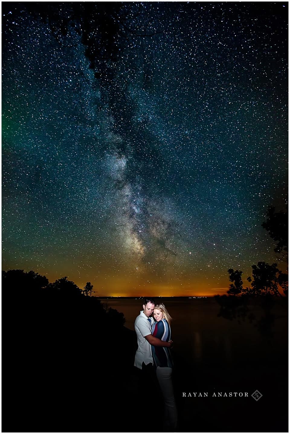 engagement photo at night with the milk way and boreal aurora
