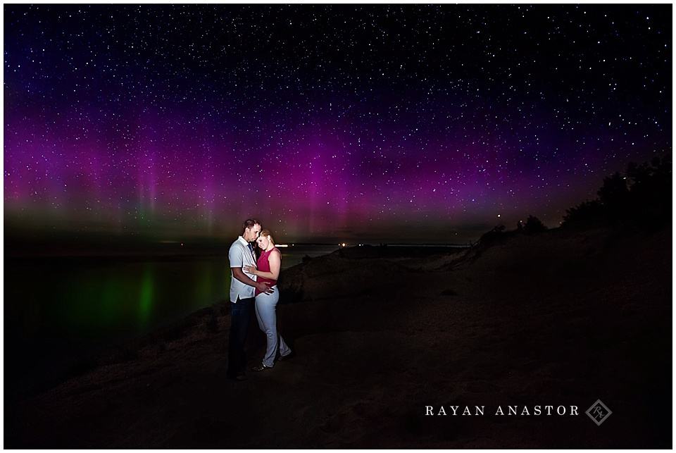 engagement photos at lake michigan and sleeping bear dunes with the northern lights