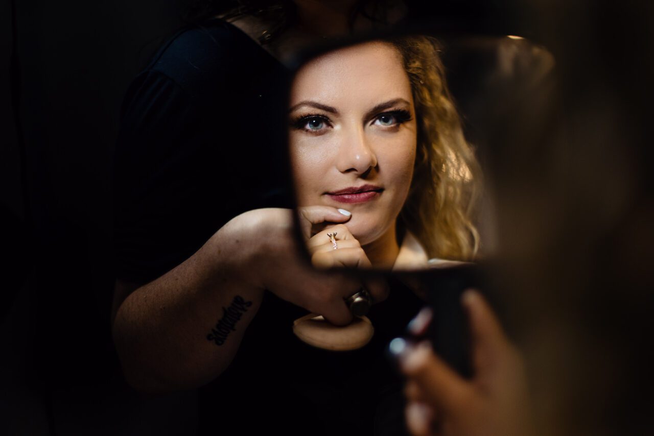 bride getting makeup done with hair and beauty lounge