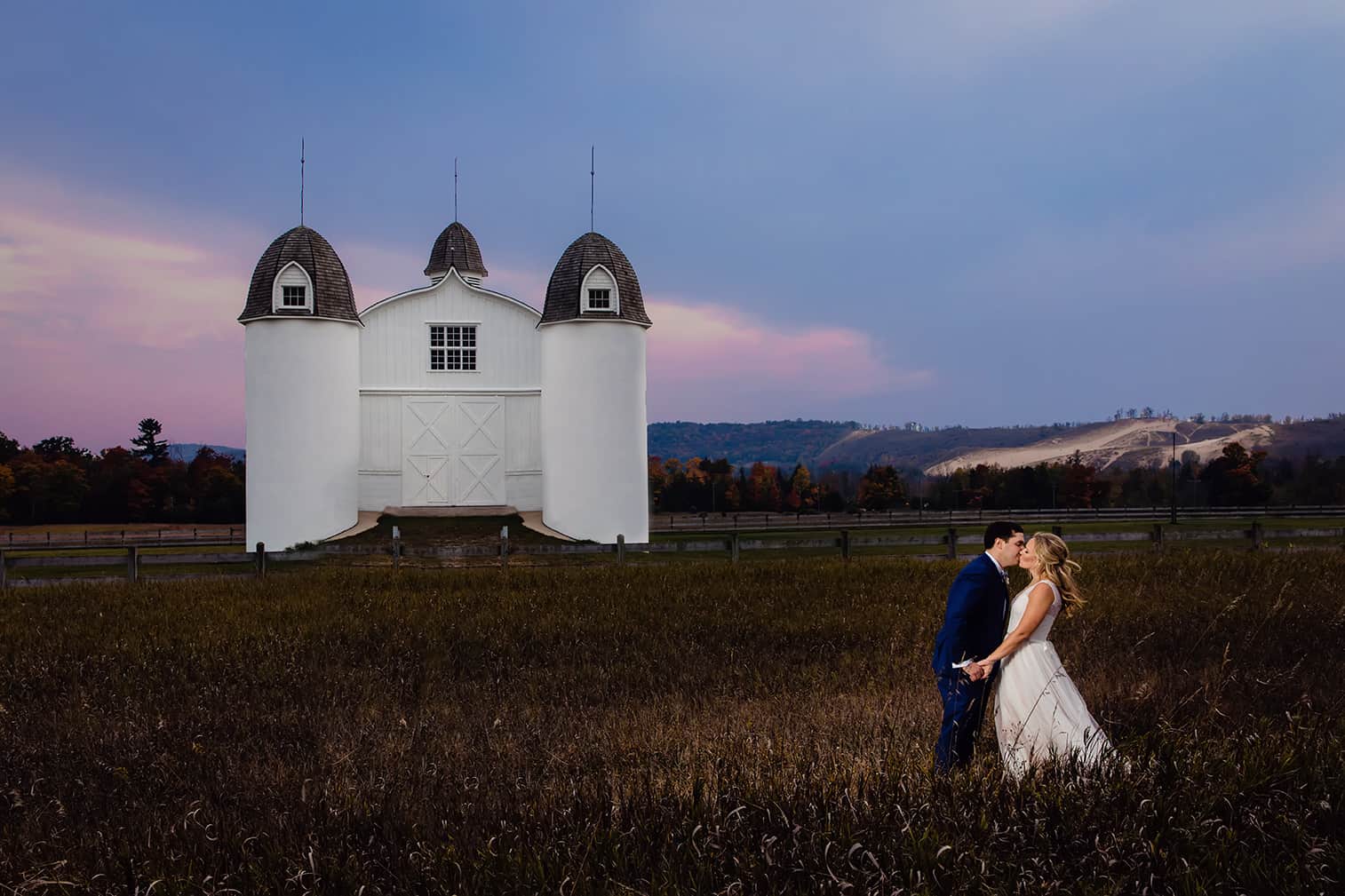 Bride and groom roasting stores at their elopement in glen arbor