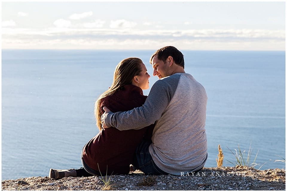 Engagement photos on sand dunes overlooking lake michigan